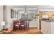 An inviting dining area with wood floors, a mirrored wall, and seating for six at 4802 51St W St # 1711, Bradenton, FL 34210