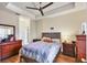 Cozy main bedroom with a ceiling fan, dresser and nightstands on hardwood floors at 4802 51St W St # 1711, Bradenton, FL 34210