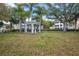 A serene picnic area featuring a gazebo and mature trees in a well-maintained, grassy lawn at 4802 51St W St # 1711, Bradenton, FL 34210