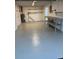 Finished garage space with clean epoxy floors and open work and storage space at 4833 Dogwood St, New Port Richey, FL 34653