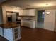 Bright kitchen boasts granite counters, stainless steel appliances, and custom island at 4833 Dogwood St, New Port Richey, FL 34653