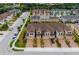 Overhead shot showing the townhome community with brick driveways and manicured lawns at 5007 Sunnyside Ln, Bradenton, FL 34211