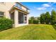A well-manicured lawn and screened-in porch create a delightful outdoor space at 5007 Sunnyside Ln, Bradenton, FL 34211
