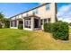 Spacious backyard featuring a screened-in porch, perfect for relaxing outdoors at 5007 Sunnyside Ln, Bradenton, FL 34211