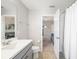 En-suite bathroom featuring a sink, toilet, and shower, is conveniently located adjacent to the bedroom at 5007 Sunnyside Ln, Bradenton, FL 34211