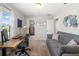 Multipurpose bedroom features a workspace with desk and sofa providing an adaptable space for work or relaxation at 5007 Sunnyside Ln, Bradenton, FL 34211
