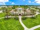 Aerial view of the community center with lush landscaping and walking path at 5007 Sunnyside Ln, Bradenton, FL 34211
