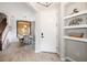 Inviting home entrance featuring wood-look floors, shelving, and a view of the dining area at 5007 Sunnyside Ln, Bradenton, FL 34211