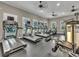 Modern exercise room with treadmills and weight machines for convenient workouts at 5007 Sunnyside Ln, Bradenton, FL 34211
