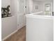 Upstairs hallway with neutral carpet, a horse statue, and white trim throughout at 5007 Sunnyside Ln, Bradenton, FL 34211