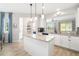 Spacious kitchen featuring granite countertops, center island and view to living area at 5007 Sunnyside Ln, Bradenton, FL 34211