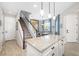 Spacious kitchen with granite countertops that connect to the dining area and stairs at 5007 Sunnyside Ln, Bradenton, FL 34211