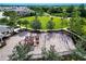A view of a playground surrounded by walking path and green space at 5007 Sunnyside Ln, Bradenton, FL 34211