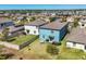 Aerial view of a home with fenced yard, patio furniture, and a grill at 5033 Brickwood Rise Dr, Wimauma, FL 33598