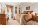 This bedroom is decorated with a wooden bed and wooden furniture at 5033 Brickwood Rise Dr, Wimauma, FL 33598