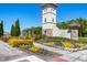 Welcome to the Sereno community, featuring manicured landscaping, stone accents, and serene ambiance at 5033 Brickwood Rise Dr, Wimauma, FL 33598