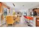 Bright, open concept living area featuring kitchen bar, dining table and a comfortable couch at 5033 Brickwood Rise Dr, Wimauma, FL 33598