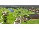 Scenic view of the well-manicured golf course, featuring lush greenery and serene water features at 52 Grande Fairway, Englewood, FL 34223