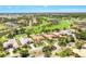 Stunning aerial view of home, showcasing the golf course and lush landscaping at 52 Grande Fairway, Englewood, FL 34223
