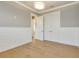 Spacious bedroom with wood flooring, gray walls, and double closet at 52 Grande Fairway, Englewood, FL 34223