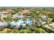 Community pool aerial view, showing amenities and landscaping, and the perfect spot for relaxation at 52 Grande Fairway, Englewood, FL 34223