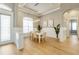 Elegant dining room featuring modern lighting and stylish decor, adjacent to the foyer at 52 Grande Fairway, Englewood, FL 34223