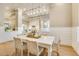 Bright dining room with a modern chandelier, comfortable seating, and an open layout at 52 Grande Fairway, Englewood, FL 34223