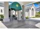 Welcoming entrance to the community clubhouse, featuring a covered entryway and elegant signage at 52 Grande Fairway, Englewood, FL 34223