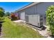 Exterior view showing a generator next to the house and garage at 52 Grande Fairway, Englewood, FL 34223