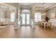Grand foyer with beautiful flooring, elegant lighting, and stylish decor at 52 Grande Fairway, Englewood, FL 34223