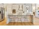 Spacious kitchen featuring a large island with seating, modern appliances, and ample counter space at 52 Grande Fairway, Englewood, FL 34223