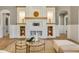 Living room featuring a fireplace with custom shelving and a decorative mantel at 52 Grande Fairway, Englewood, FL 34223