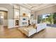 Comfortable living room with a custom fireplace, built-in shelving, and access to the patio at 52 Grande Fairway, Englewood, FL 34223