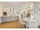 Open-concept living space with a modern kitchen, dining area, and comfortable seating at 52 Grande Fairway, Englewood, FL 34223