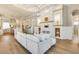 Spacious open-concept living area with a kitchen, living room, and fireplace at 52 Grande Fairway, Englewood, FL 34223