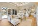 Expansive living space with an open floor plan, including the living room, dining area, and kitchen at 52 Grande Fairway, Englewood, FL 34223