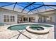 Inviting screened-in pool and patio area, perfect for relaxation and entertaining at 52 Grande Fairway, Englewood, FL 34223
