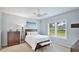 Bright bedroom with a ceiling fan, light gray walls, and neutral-toned decor at 5450 Fairfield Blvd, Bradenton, FL 34203