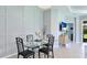 Dining room with a glass table, black metal chairs, and decorative wall accents at 5450 Fairfield Blvd, Bradenton, FL 34203