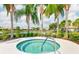 Enjoy the community hot tub nestled amongst the mature landscaping and tranquil pond views at 5450 Fairfield Blvd, Bradenton, FL 34203
