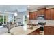 Modern kitchen features granite countertops, stainless steel appliances, and dark wood cabinetry at 5450 Fairfield Blvd, Bradenton, FL 34203