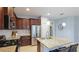 Updated kitchen features stainless steel appliances, granite countertops, and pendant lighting at 5450 Fairfield Blvd, Bradenton, FL 34203