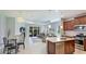 Open-concept living space with modern decor and abundant natural light and a view of the kitchen at 5450 Fairfield Blvd, Bradenton, FL 34203