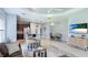 Open-concept living room with dining area and kitchen views, perfect for entertaining at 5450 Fairfield Blvd, Bradenton, FL 34203