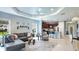 Spacious living room with ample seating, natural light, and open flow to kitchen and dining at 5450 Fairfield Blvd, Bradenton, FL 34203