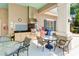 The outdoor kitchen features stainless steel appliances, granite counters, and seating areas for relaxed entertaining at 5450 Fairfield Blvd, Bradenton, FL 34203