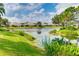 Scenic pond surrounded by green landscaping reflecting the community's tranquil ambiance at 5450 Fairfield Blvd, Bradenton, FL 34203
