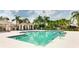 A beautiful community pool with palm trees and a gazebo creates a relaxing outdoor living space for residents at 5450 Fairfield Blvd, Bradenton, FL 34203