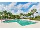 Community pool surrounded by palm trees offering a refreshing outdoor retreat at 5450 Fairfield Blvd, Bradenton, FL 34203