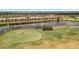 Aerial shot of a golf course community featuring a lake, fairways, and residential homes at 5624 Palmer Cir # 101, Bradenton, FL 34211
